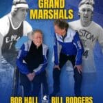 Two retired marathoners smiling at each other in track suits, one in a wheelchair. Behind them are images of the same men younger. Text reads: 2025 Grand Marshals. Bob Hall. Bill Rodgers. Logo for the Boston Marathon.