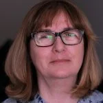 Headshot of a woman wearing glasses